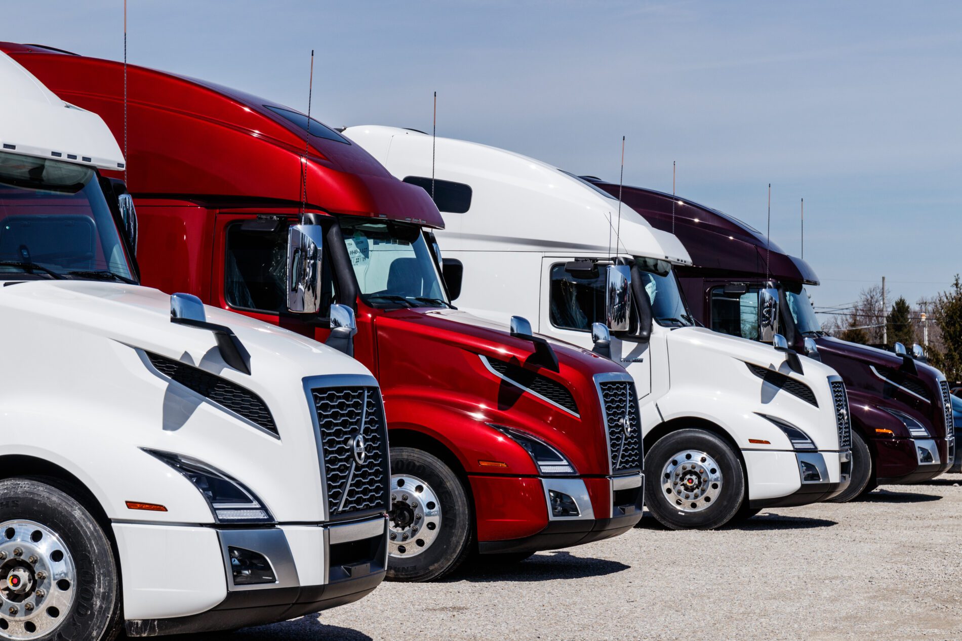 Muncie - Circa March 2019: Colorful Volvo Semi Tractor Trailer Trucks Lined up for Sale. Volvo is one of the largest truck manufacturers II